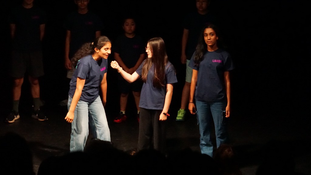 Students performing a scene at a performing arts showcase